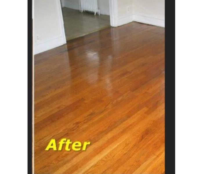 Refinished hardwood floor restored after water damage 